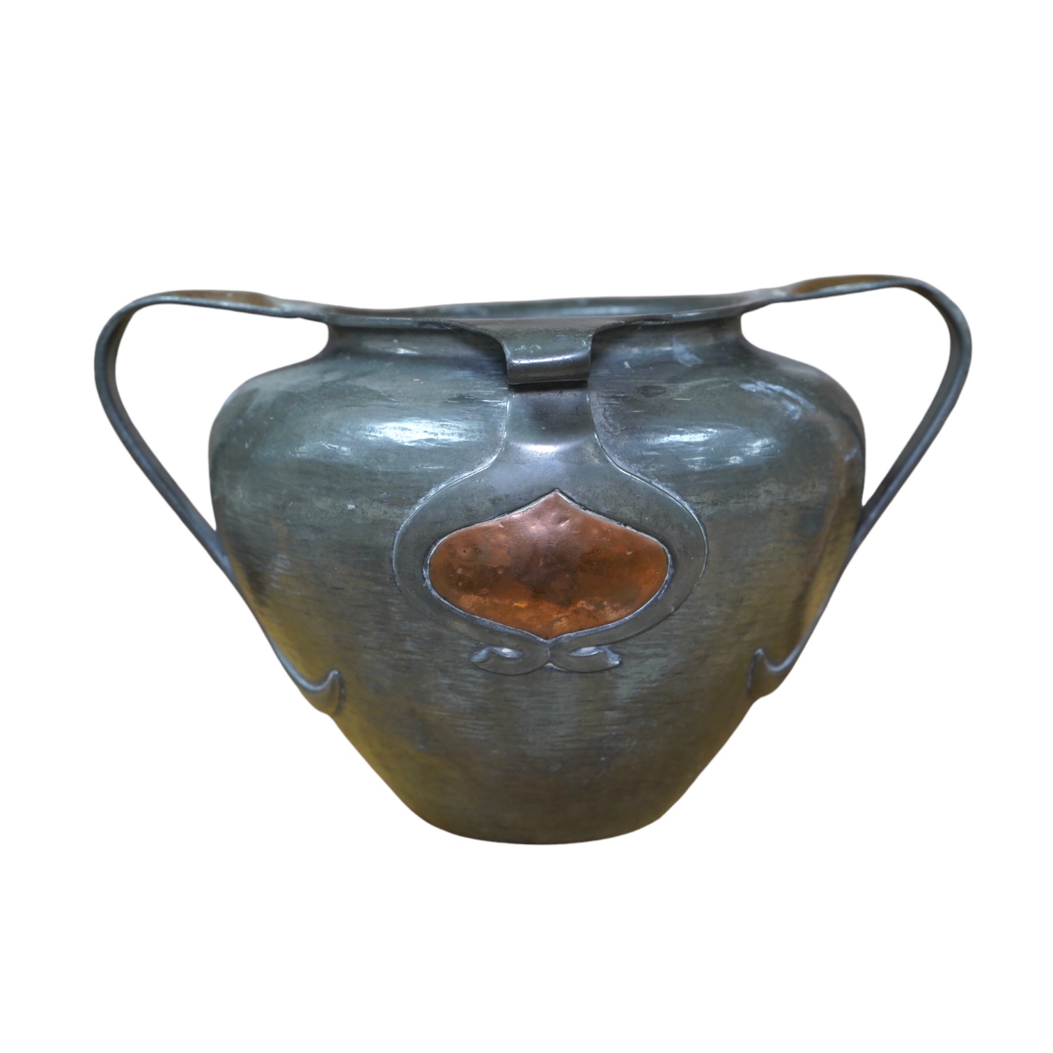 Oliver Baker for Liberty & Co, a Tudric pewter and copper vase, no.0864, c.1910, 25cm wide. Condition - fair to good